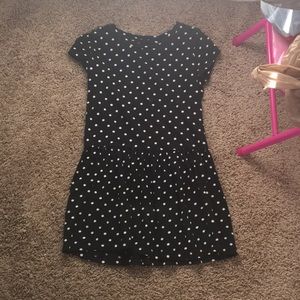 A black poke o dot dress with clip gold buttons